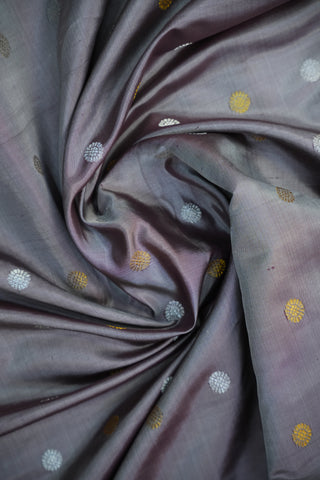 Purple fabric with circular patterns in gold and white